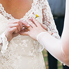 Two women in ring ceremony.