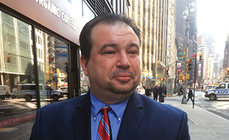 Jeffrey Deskovic on New York sidewalk.