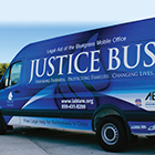 Van with slogan Justice Bus.