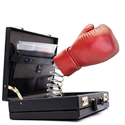 Boxing glove springs from briefcase.