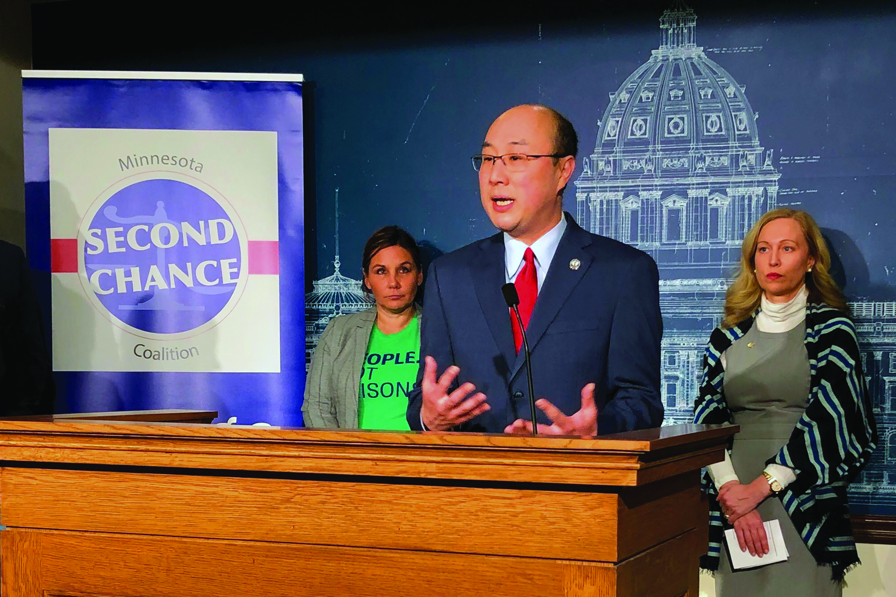 John Choi at a podium