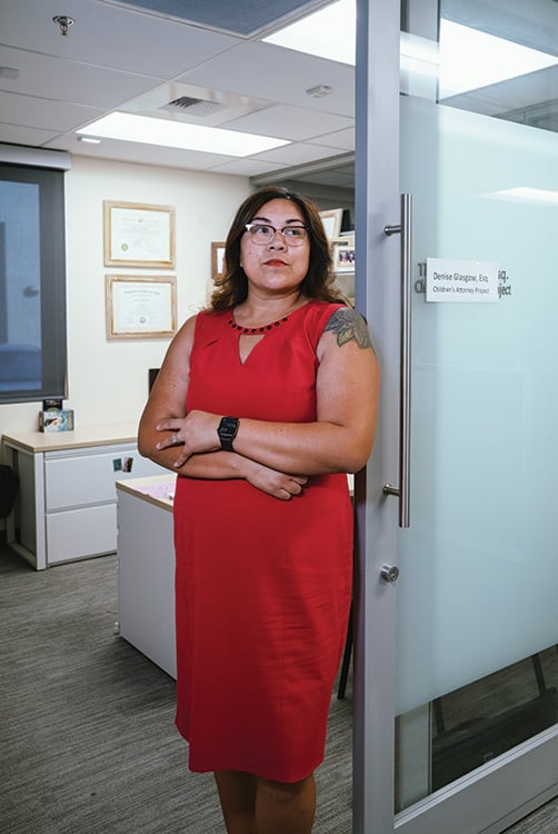 Woman poses in an office environment