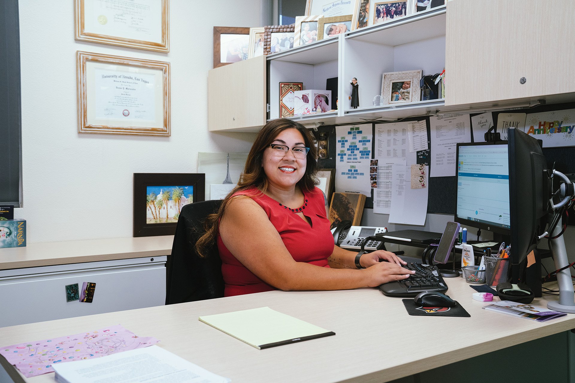 Woman poses in an office environment