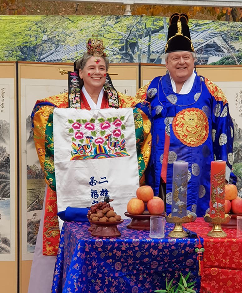 Mary and Gay wearing traditional Korean garments