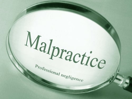 malpractice words and magnifying glass